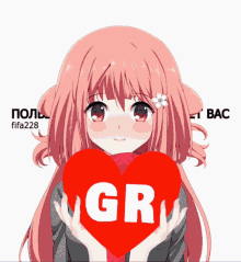 a girl with pink hair is holding a red heart that says gr on it