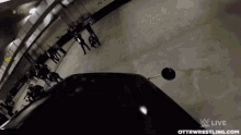 a group of people are riding bikes in a parking garage .