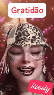 a woman wearing a leopard print hat and earrings says gratidão