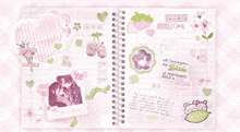 a notebook with a picture of a cat and a strawberry on the cover