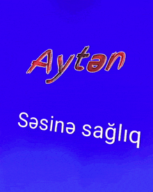 a blue background with aytan written in red