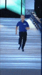 a man in a blue shirt that says ' abercrombie & fitch ' on it