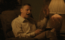a man sitting in a chair with the words " do n't spoil it " written above him