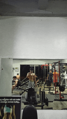 a sign in a gym says that weights will not make average woman bulky