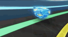 a blue spinning top is flying through the air on a track .