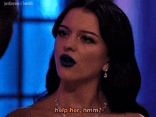 a woman with dark blue lipstick is asking for help