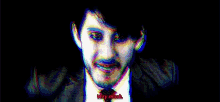 a man in a suit and tie is smiling and says " very much "