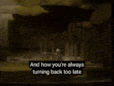 a man in a suit stands in front of trees with the words and how you 're always turning back too late below him