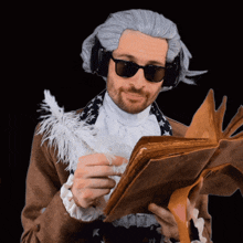 a man in a wig is reading a book