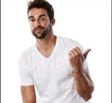 a man with a beard is wearing a white shirt and giving a thumbs up sign