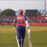 a cricket player with the number 64 on their back