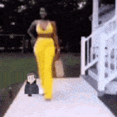 a cartoon of a man standing next to a woman in yellow