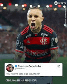 a soccer player is celebrating a goal on a soccer field with his mouth open .