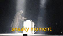 a sneaky moment is written in yellow on a stage