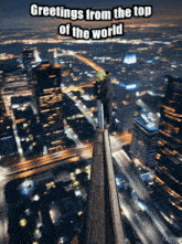 greetings from the top of the world written on a picture of a city