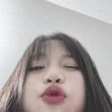 a close up of a woman making a funny face