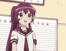 a girl with purple hair is standing in front of a board with japanese writing on it .