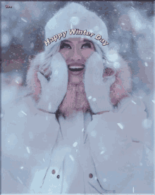 a picture of a woman in the snow with the words happy winter day on it