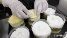 a video of a person making a cake with the words made in animatica at the top