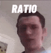 a close up of a man 's face with the word ratio written above him .