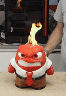 a cartoon character with fire coming out of its head