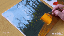 a person is painting a picture with the words made in animatica