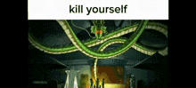 a cartoon of a green dragon with the words `` kill yourself '' written on it .