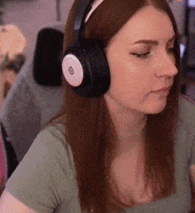 a woman wearing headphones with the letter o on the top