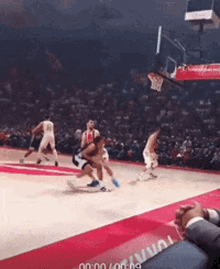 a basketball game is being played in front of a crowd and the clock reads 60 seconds