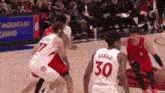 a basketball game is being played in front of a mountain casino