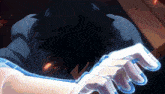 a close up of a person 's face with a glowing hand behind it