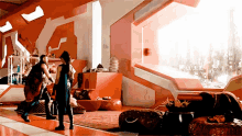 two men are standing in a room with a large window