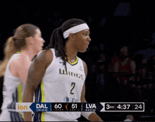 a female basketball player wearing a jersey that says wings