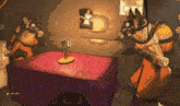two robots are standing around a table with candles on it in a room