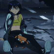 a girl in a yellow tank top is sitting on the ground with a robot in her lap