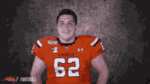 a football player wearing a jersey with the number 62