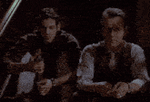 two men are sitting next to each other with the words she was truly the finest of all of us