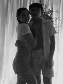 a black and white photo of a man and a woman