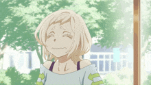 a cartoon girl is laughing with her eyes closed