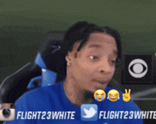 a man wearing a blue shirt with flight23white written on it