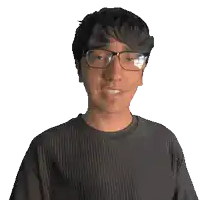 a young man wearing glasses and a shirt that says sincere
