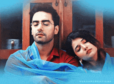 a man and a woman are wrapped in a blue cloth with the word ruksarcreations on the bottom