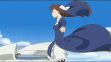 a girl in a blue and white dress stands in the wind