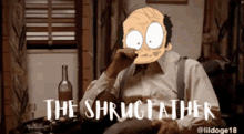 a man with a cartoon face on his face is sitting at a table with the words the shrugged father written on the bottom