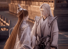 a man and a woman are standing next to each other in a traditional costume and looking at each other .
