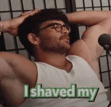 a man in a white tank top with the words i shaved my on the bottom