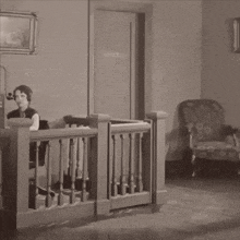 a woman sits at a desk in front of an office