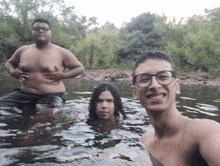 a group of people are swimming in a river