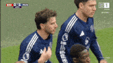 a soccer game is being played on a television screen