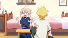 a boy and a girl are sitting in a bedroom